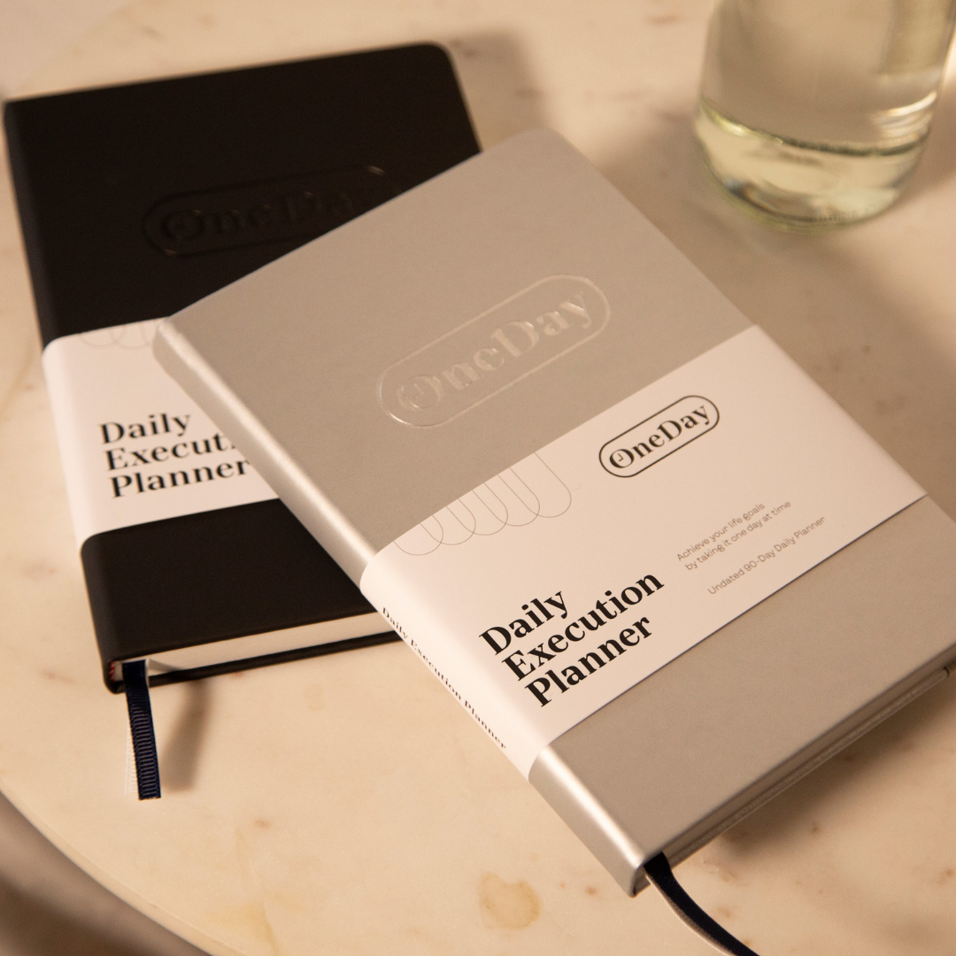 Goal Getter Gray Daily Execution Planner with faux leather cover and elastic closure, designed for goal-setting and productivity.